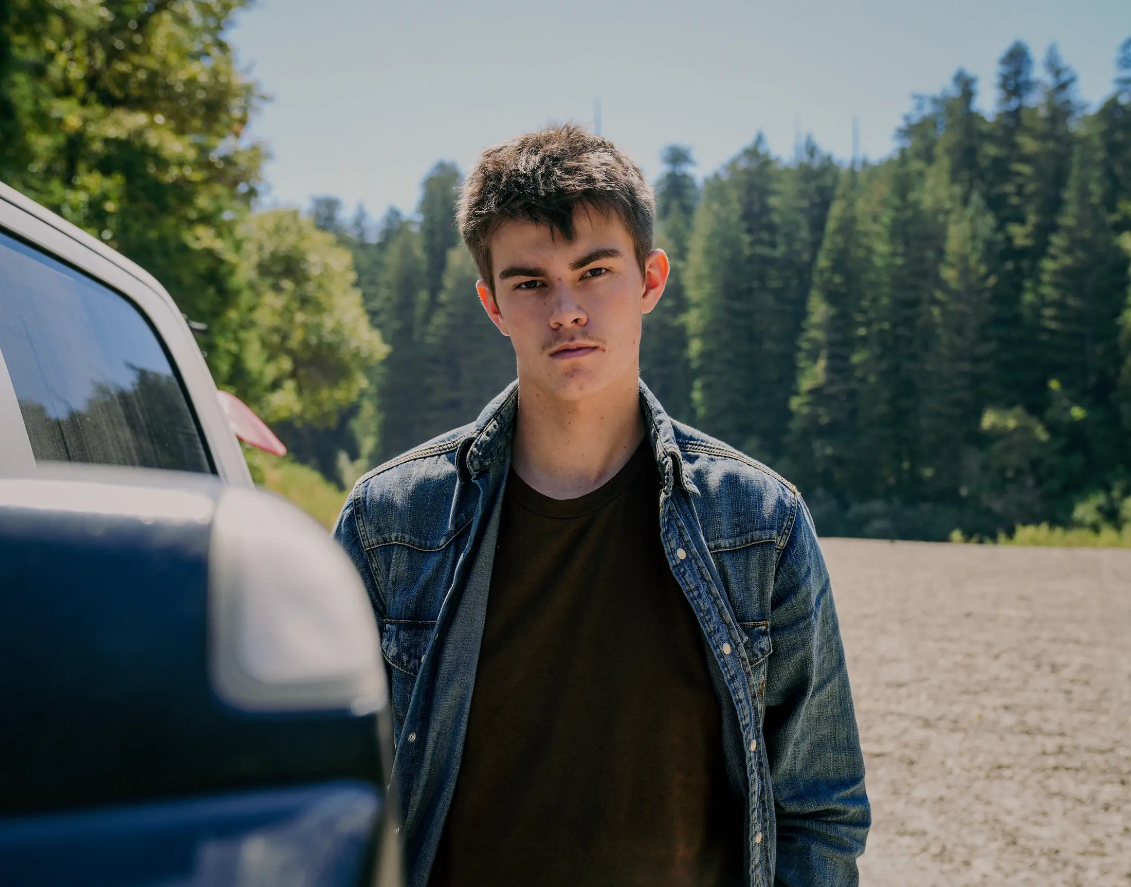 Portrait of Luke Powell in a denim jacket outdoors in Northern California